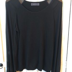 For a sexy night on the town. Black top with sheer long sleeves.